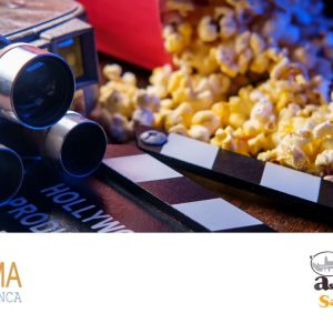 Proyector antiguo, palomitas y claqueta sobre fondo oscuro, con los logotipos de FICMA y Famasa.